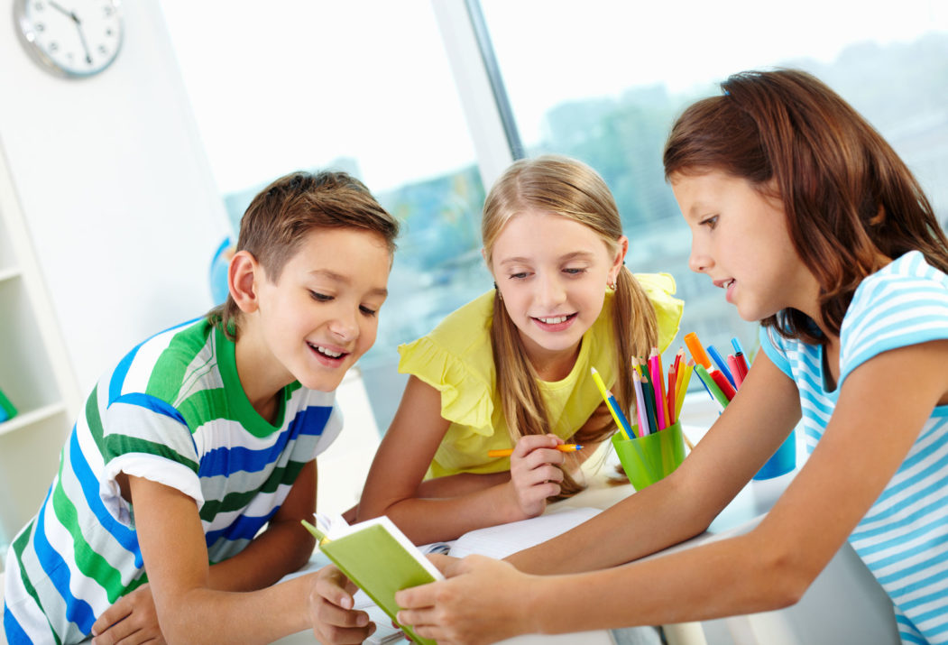 classmates being curious about what their friend reading