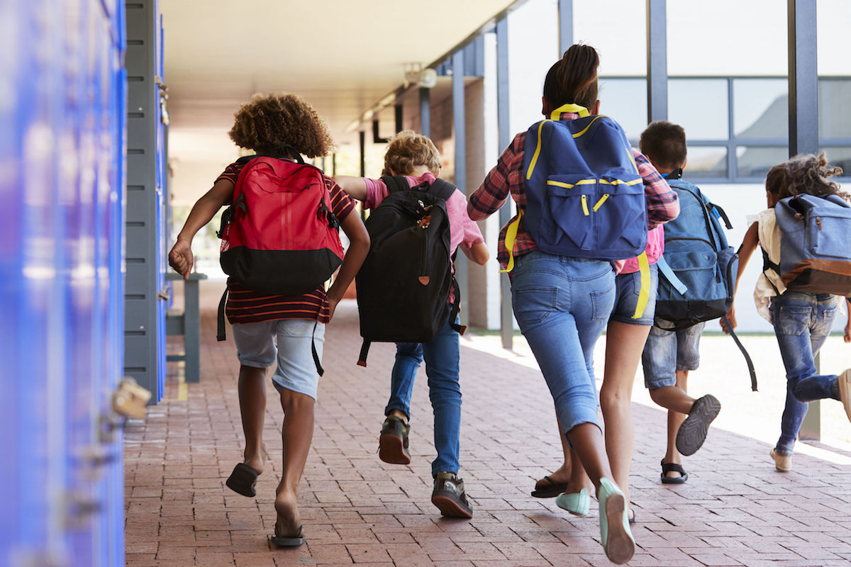 kid running with backpack