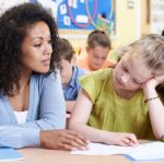 Teacher Female Elementary School Pupil With Problem