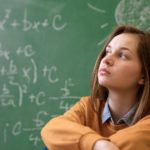 Teenager girl in math class overwhelmed by the math formula. Pressure, Education, Success concept.