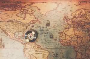 Columbus day and world map with compass