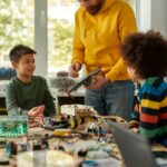 Cropped shot of young creative male teacher explaining for students the principle of quadcopter work. Science and education. Horizontal shot. Web Banner