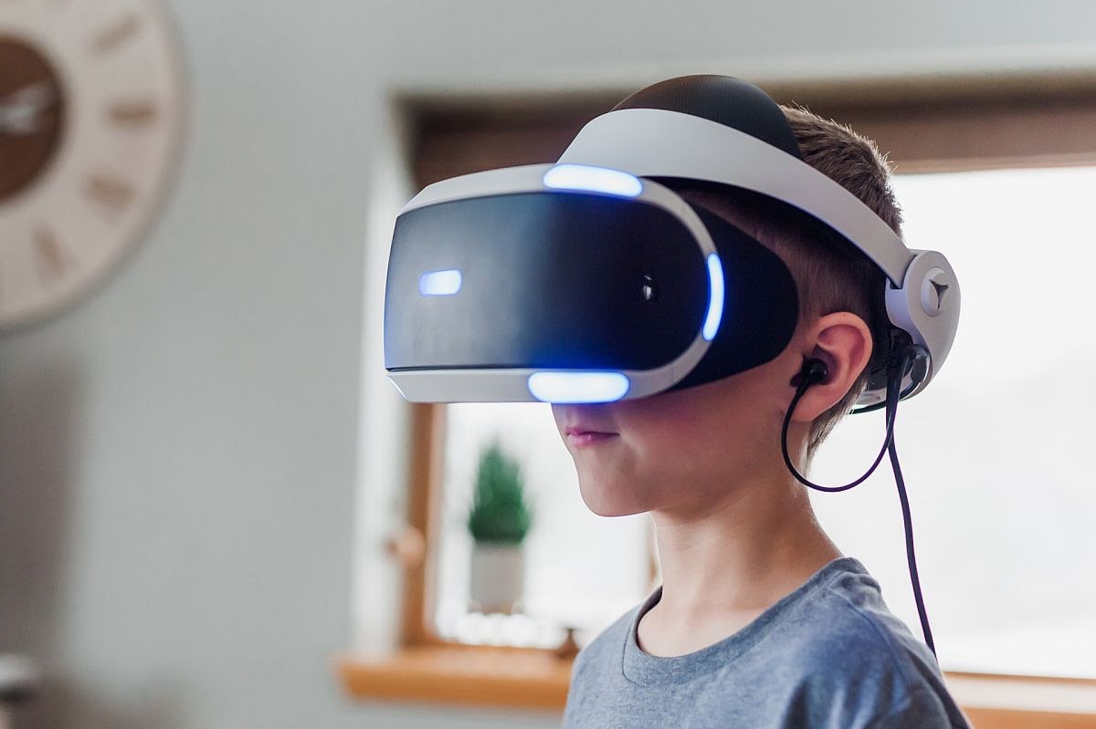 child in VR headset; metaverse learning concept