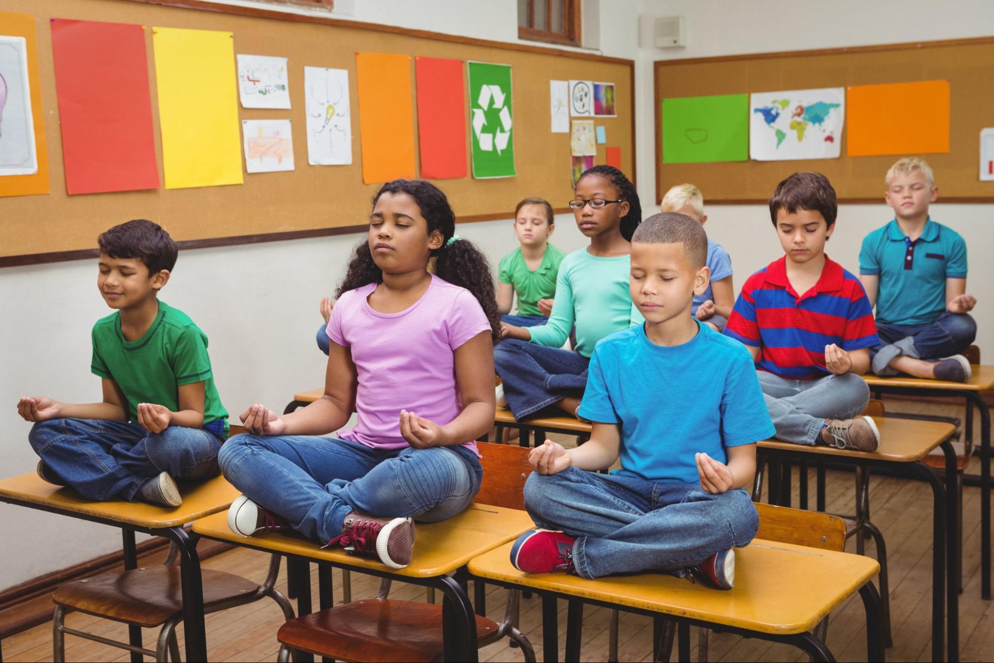 first graders practicing meditation in a classroom; Social-Emotional Development concept