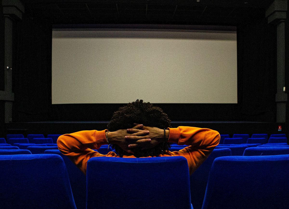 student alone in a movie theatre; classroom movies concept