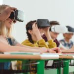 Students using virtual reality headset in class; virtual field trips concept