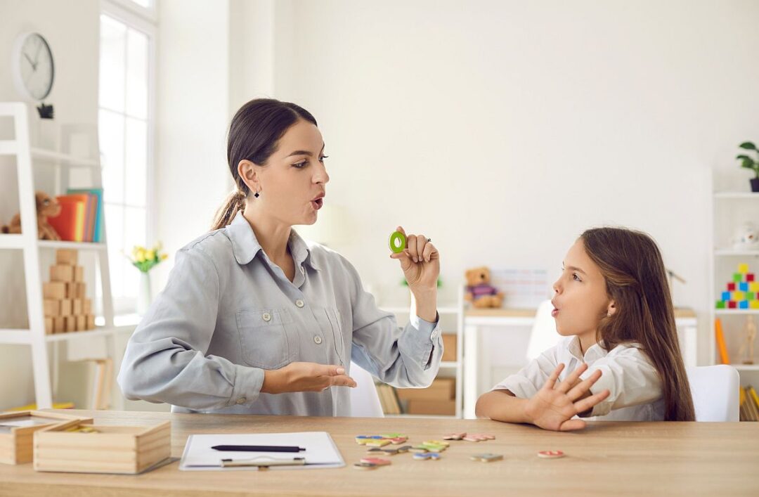 Teacher working with child; help students with learning disabilities concept