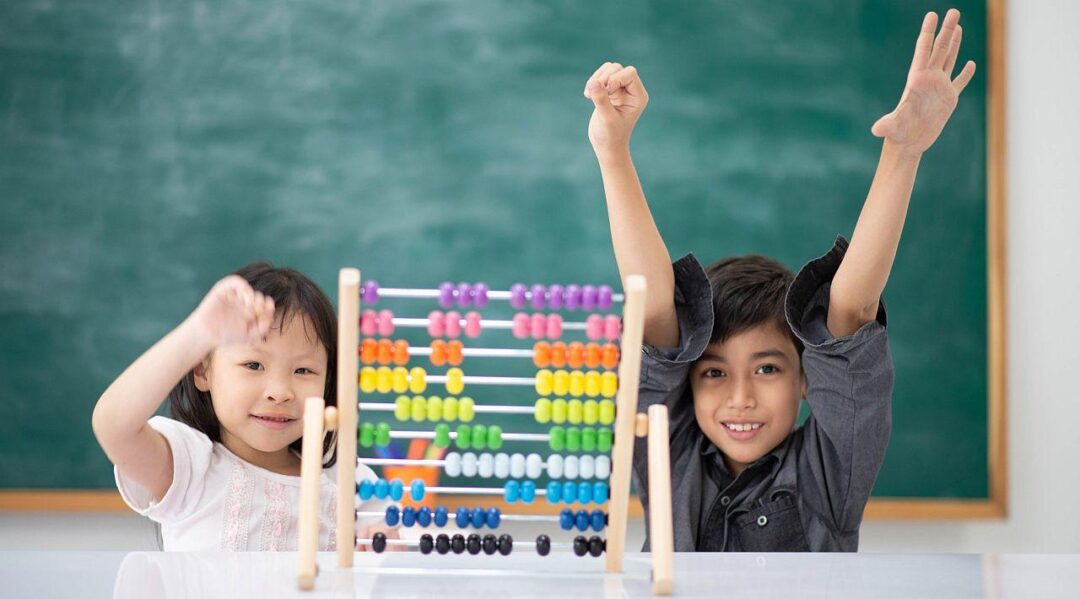 Children in classroom working on abacus; math anxiety concept