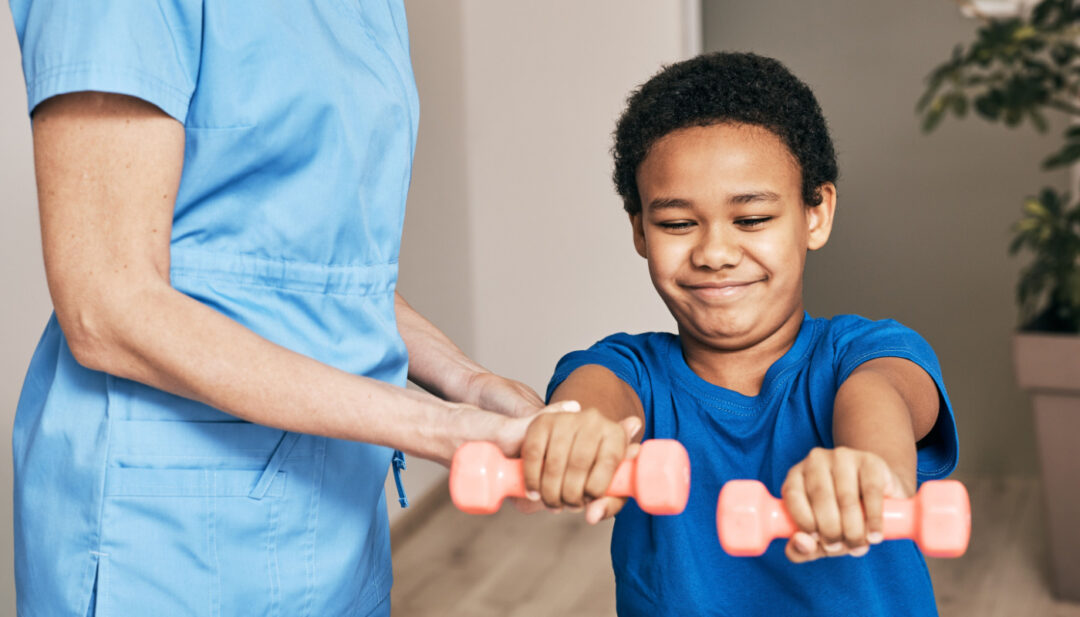 Physical therapist working with student; physical therapists role concept